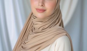 Close up shot of a woman wearing a beige Premium Maxi Jersey Hijab