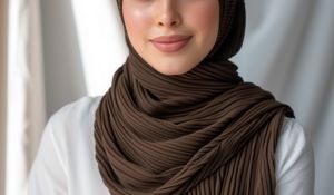 close up shot of a model wearing a dark brown ribbed jersey hijab