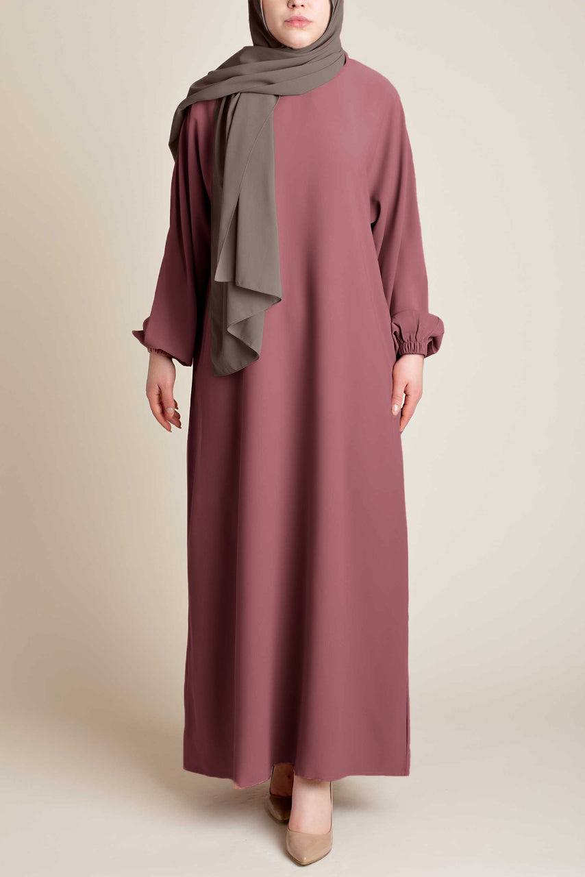Model wearing a classic Abaya with side pockets in a muted purple color - Front Pose - Momina Hijabs