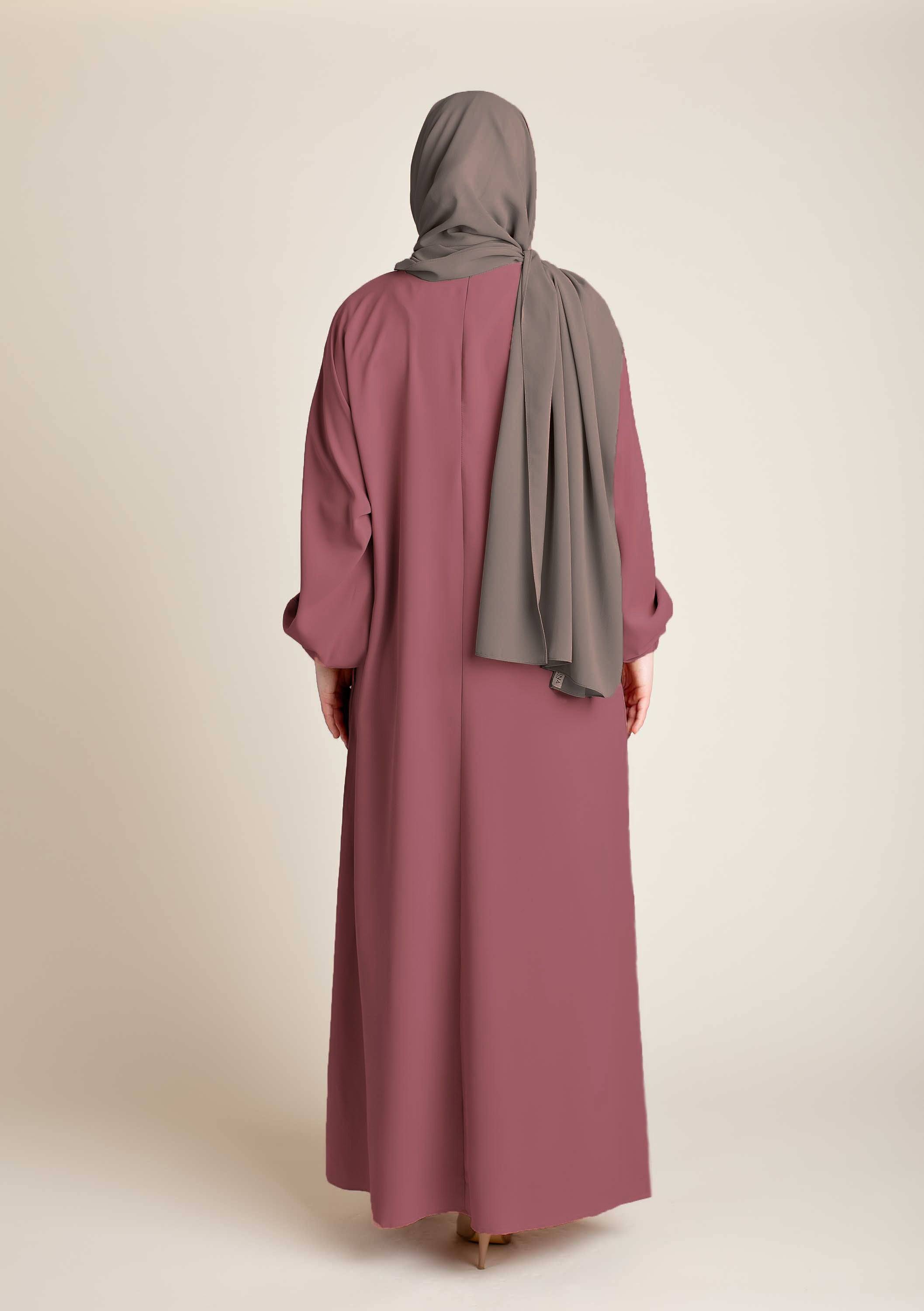 Model wearing a classic Abaya with side pockets in a muted purple color - Rear pose - Momina HIjabs