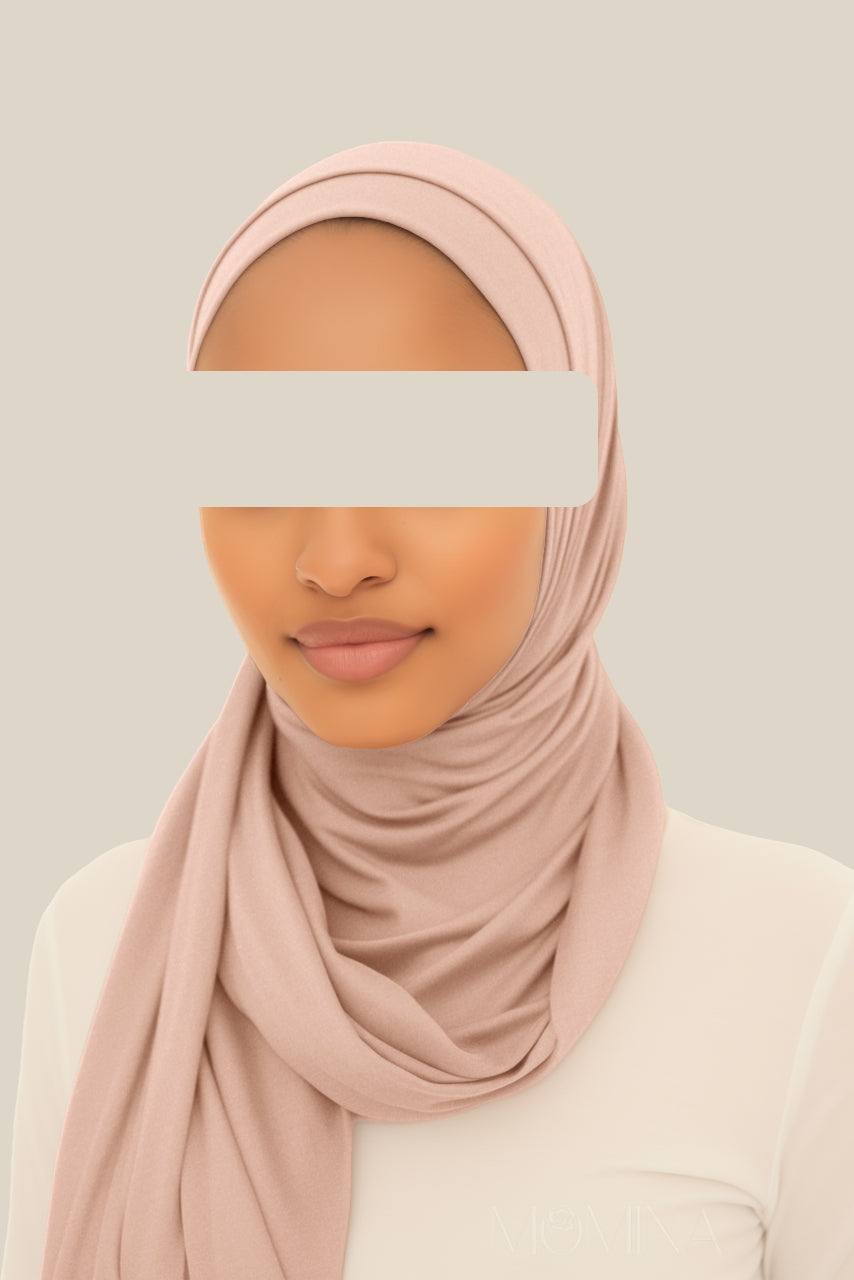 A woman wearing the Matching Premium Jersey Hijab & Undercap Set - Praline by Momina Hijabs